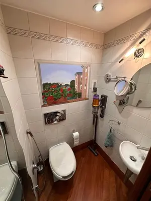 a bathroom with a toilet and a sink at Casa Turchina in Rome