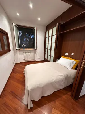 a bedroom with a large bed and a window at Casa Turchina in Rome