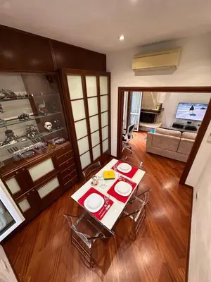 a living room with a table and a couch at Casa Turchina in Rome