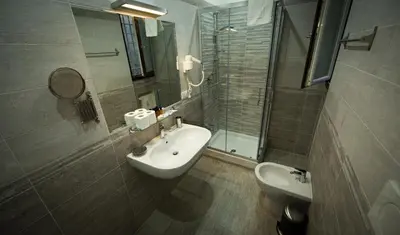 a bathroom with a sink and a toilet and a shower at Love of Rome in Rome