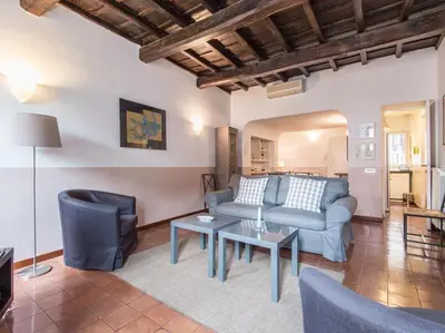a living room with a couch and a table at Spacious 2BR in the historic center in Rome