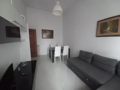 a living room with a couch and a table at tommy's house in Rome