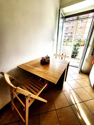 a wooden table with a bag sitting on top of it at Da Zia Elena in Rome