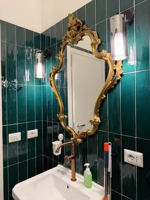 a bathroom with a sink and a mirror on the wall at Roma center home in Rome