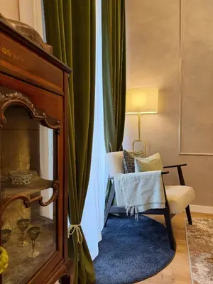a living room with a couch and a chair at Roma center home in Rome