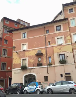 a building with cars parked in front of it at NAVONA, Old Rome Lodge in Rome