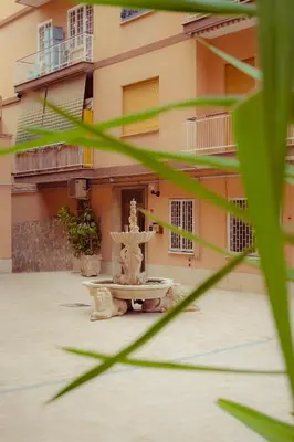 a fountain in front of a building at Urban House Monteverde in Rome