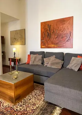 a living room with a couch and a coffee table at La Casa di Pina in Rome