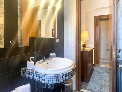 a bathroom with a sink and a mirror at La Casa di Pina in Rome