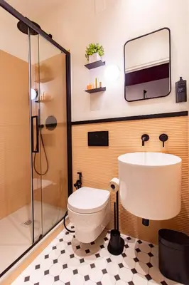 a bathroom with a toilet and a sink and a shower at Saint Suites in Rome
