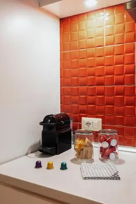 a kitchen counter top with a toaster and some food at Lungotevere Trastevere Loft in Rome