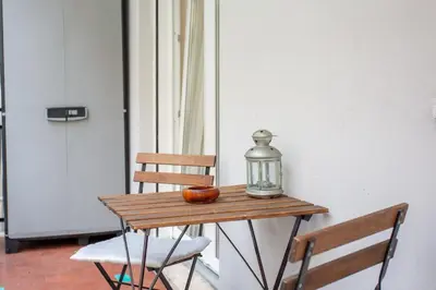 a table with a lantern and an orange on it at Casina Soleggiata in Rome
