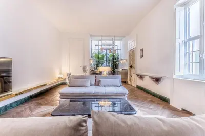 a living room with two couches and a table at EVA Loft in Rome