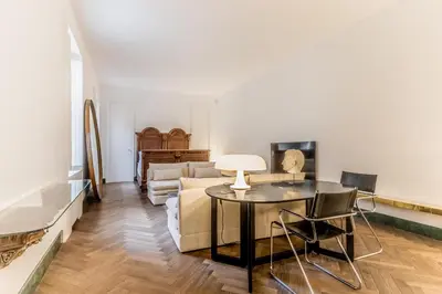 a living room with a table and a couch at EVA Loft in Rome