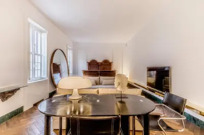 a living room with a table and a couch at EVA Loft in Rome