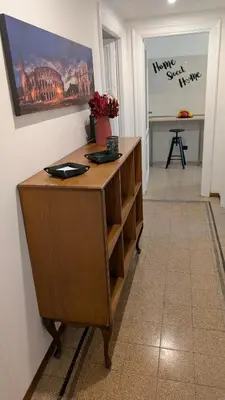 a desk in a room with a painting on the wall at Eleganza e stile Capitolino in Rome