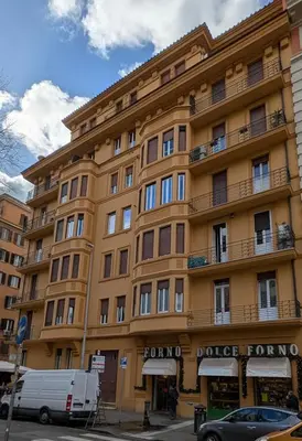 a large yellow building with a police department at Eleganza e stile Capitolino in Rome