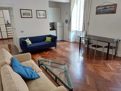 a living room with a couch and a table at la casa del Duca a Monti in Rome