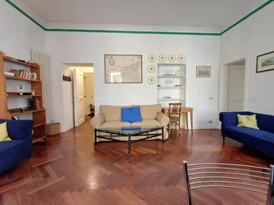 a living room with a couch and a table at la casa del Duca a Monti in Rome