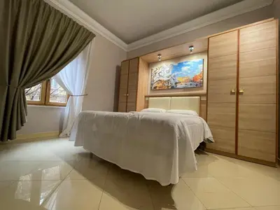 a bedroom with a bed and a large window at Spqr Suite Guest House in Rome