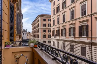 a view of a city street from a balcony at Rose Inn Guest House in Rome