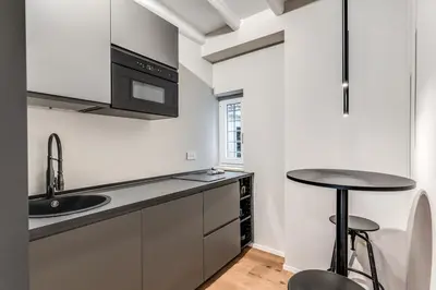a kitchen with a sink and a counter top at Vicolo Orsoline Piazza Spagna in Rome