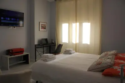 a bedroom with a bed with towels on it at Alicemaria Vatican Comfortable Apartment in Rome