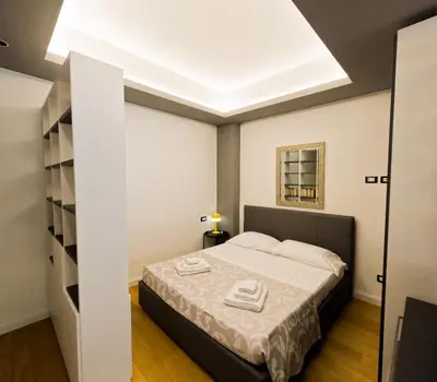 a bedroom with a bed in a room at Appartamento Appia metro A Colli Albani in Rome