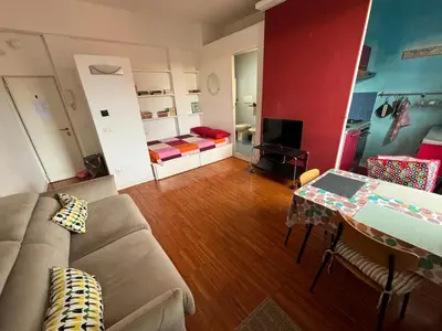 a living room with a couch and a table at Roma, Città degli Uomini in Rome