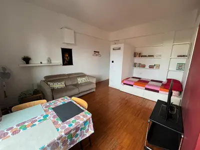 a living room with a couch and a table at Roma, Città degli Uomini in Rome