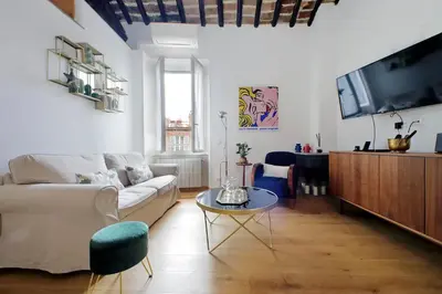 a living room with a couch and a tv at Montevecchio2 in Rome