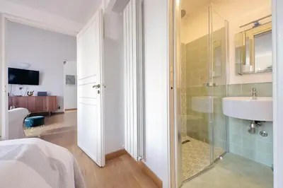 a bathroom with a glass shower and a sink at Montevecchio2 in Rome