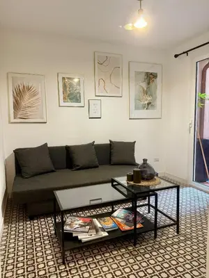 a living room with a couch and a table at Monti Cozy Apartment in Rome