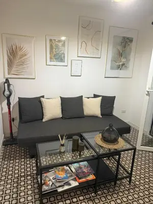 a living room with a couch and a table at Monti Cozy Apartment in Rome