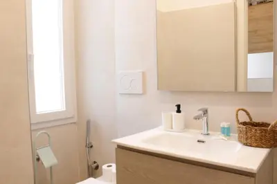 a bathroom with a sink and a toilet at HC - Miriam's Brand New Apartment in Vatican in Rome