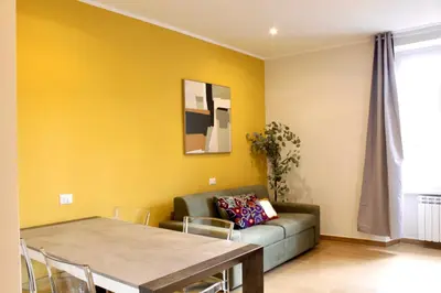 a living room with a couch and a table at HC - Miriam's Brand New Apartment in Vatican in Rome