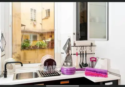 a kitchen counter with a sink and a window at LoL-ApartmenT, in the heart of Trastevere in Rome