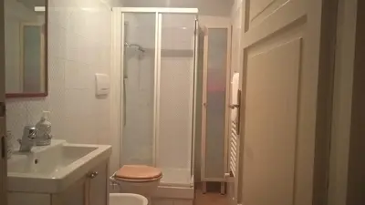 a bathroom with a shower and a toilet and a sink at Casa Aventino in Rome