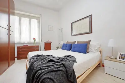 a bedroom with a bed with a blanket on it at Casa Giannetta in Rome
