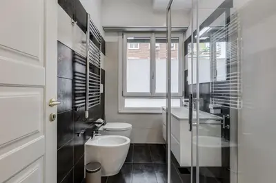 a bathroom with a sink and a shower at Boutique Apartment in Vatican in Rome