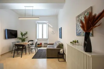 a living room with a couch and a table at Residenza Gradinata al Vaticano in Rome