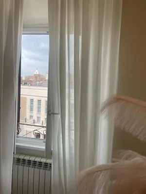 a bedroom with a window with a view of a building at Rome Opera Theatre Rooms by Dama - Termini Station & Rome City Center in Rome