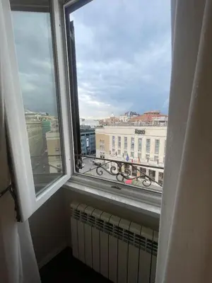 a window with a view of a city at Rome Opera Theatre Rooms by Dama - Termini Station & Rome City Center in Rome