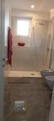 a bathroom with a shower and a toilet at Dodo's luxury house in Santa Maria Maggiore in Rome
