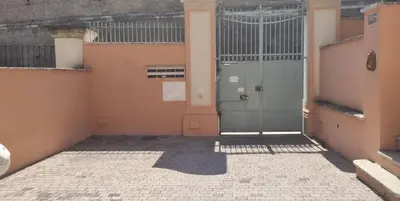 an empty room with a door in a building at Amalia Vatican House in Rome