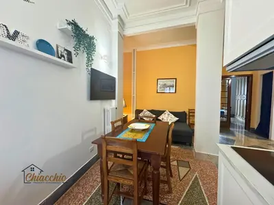 a kitchen and dining room with a table and chairs at Satrico43 - San Giovanni Stay in Rome