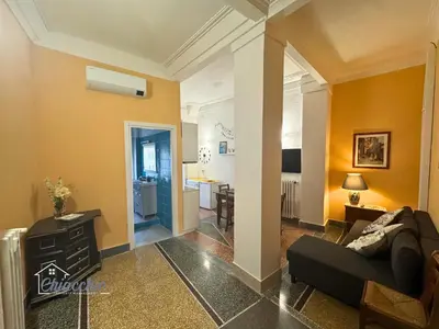 a living room with a couch and a table at Satrico43 - San Giovanni Stay in Rome
