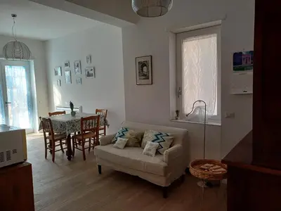 a living room with a couch and a table at Il giardino dell'Eden 10 - Alloggio Turistico in Rome