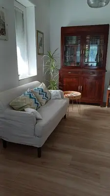 a living room with a couch and a table at Il giardino dell'Eden 10 - Alloggio Turistico in Rome