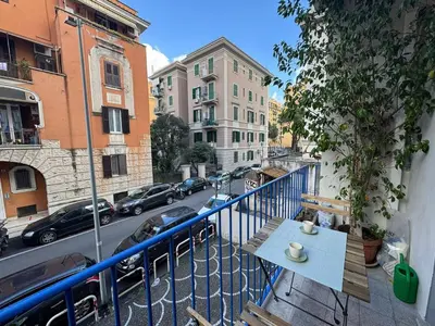 a balcony with a table and a view of a street at Flaminia Apartment - Metro A in Rome